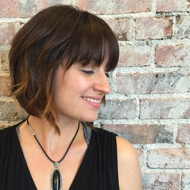 Medium-short A-line bob with fringe and highlighted tips